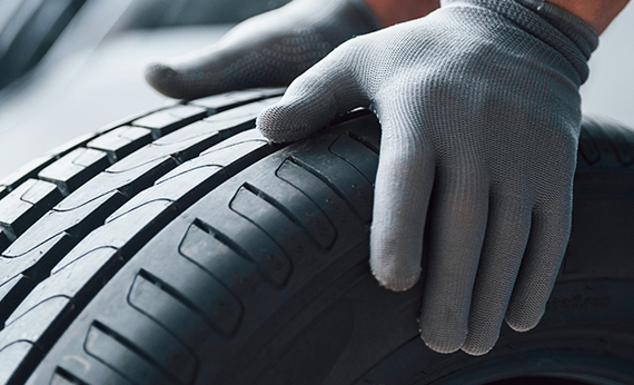 What parts does the basic structure of a tire consist of?